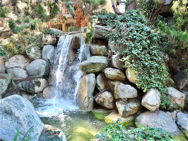 a view of swimming pool with seating space