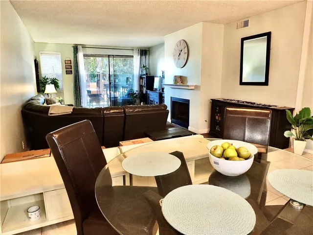 a living room with a couch and chairs