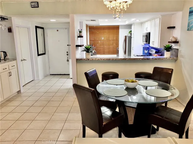 a kitchen with a table and chairs