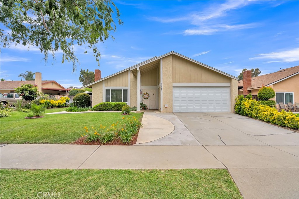 6825 Crest Avenue Riverside, CA 92503 - Photo 1 of 1 a front view of a house with a yard and garage