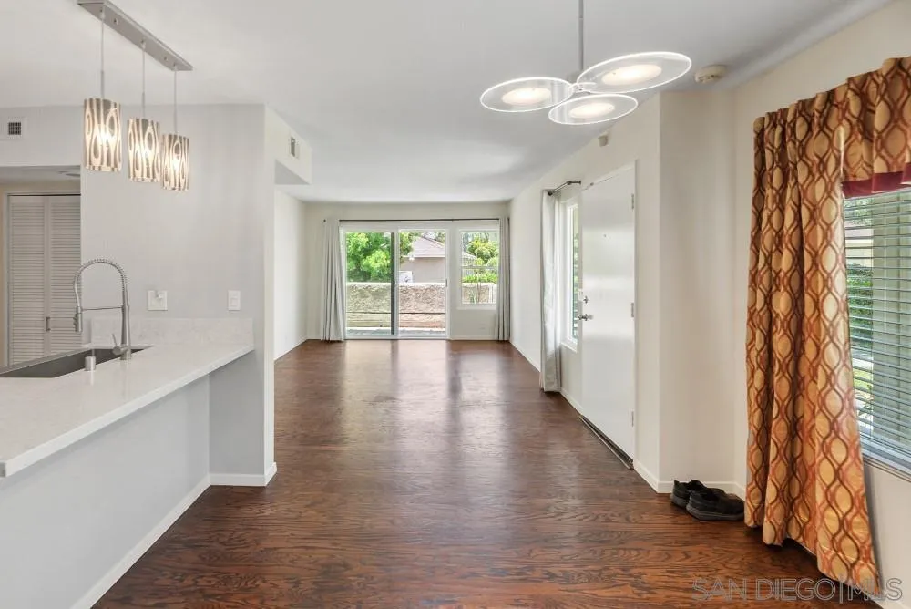 219 Diamond Way, Unit 115 Vista, CA 92083 - Photo 18 of 36 a view of an entryway with wooden floor and a window