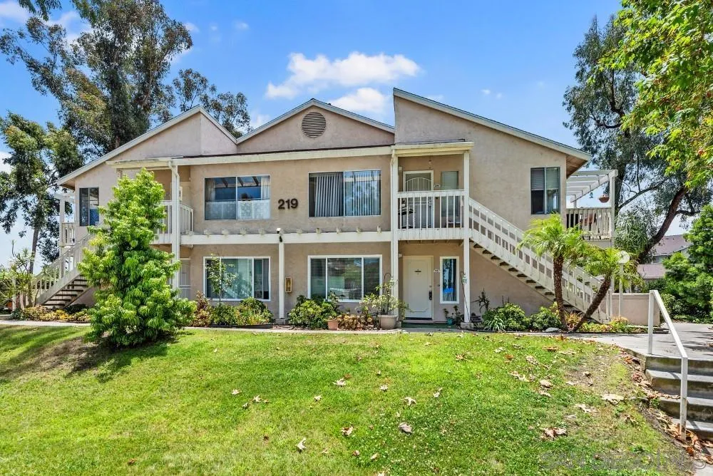 219 Diamond Way, Unit 115 Vista, CA 92083 - Photo 2 of 36 a front view of a house with a yard