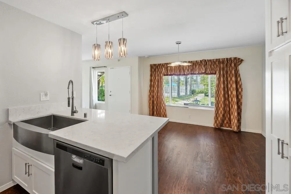 219 Diamond Way, Unit 115 Vista, CA 92083 - Photo 21 of 36 a kitchen that has a sink and a large window