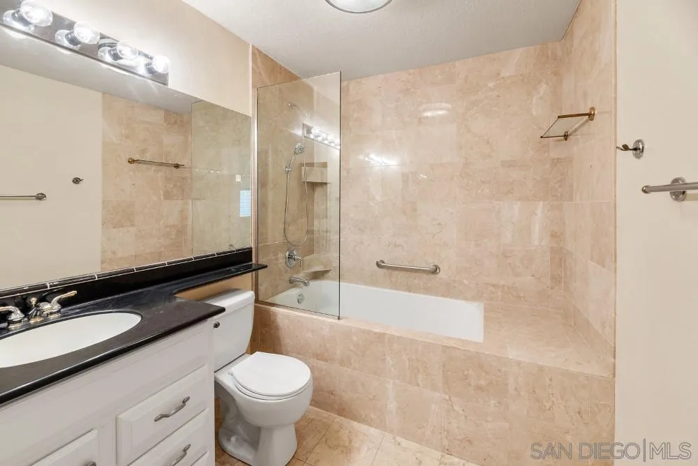 219 Diamond Way, Unit 115 Vista, CA 92083 - Photo 25 of 36 a bathroom with a sink toilet and shower