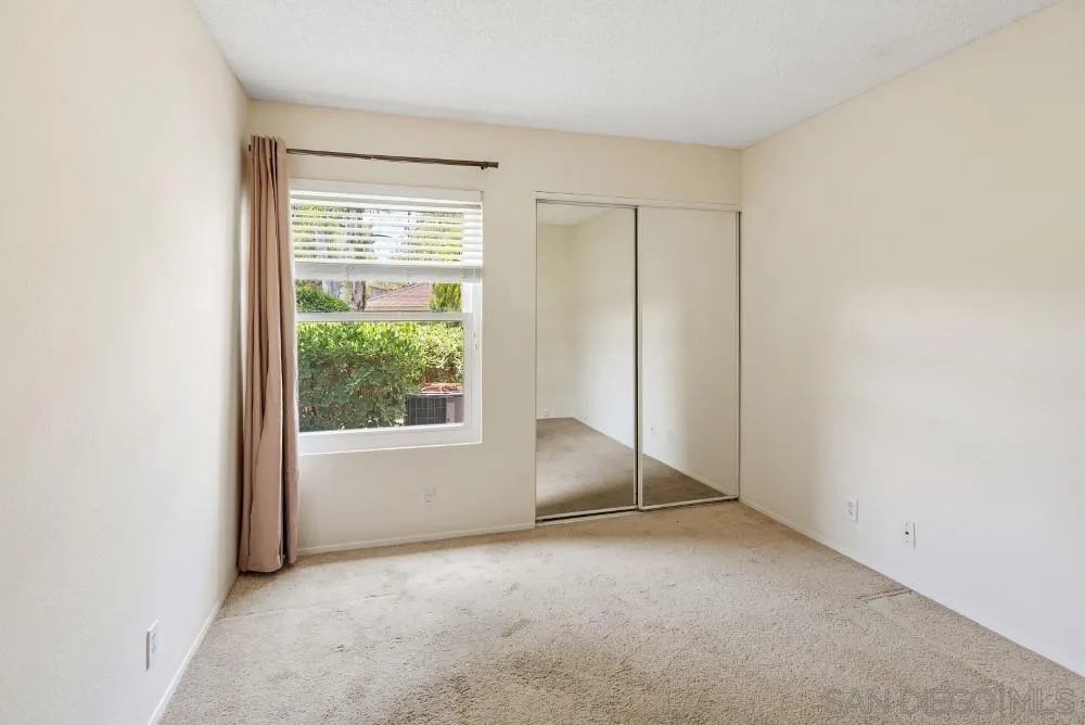 219 Diamond Way, Unit 115 Vista, CA 92083 - Photo 28 of 36 an empty room with windows