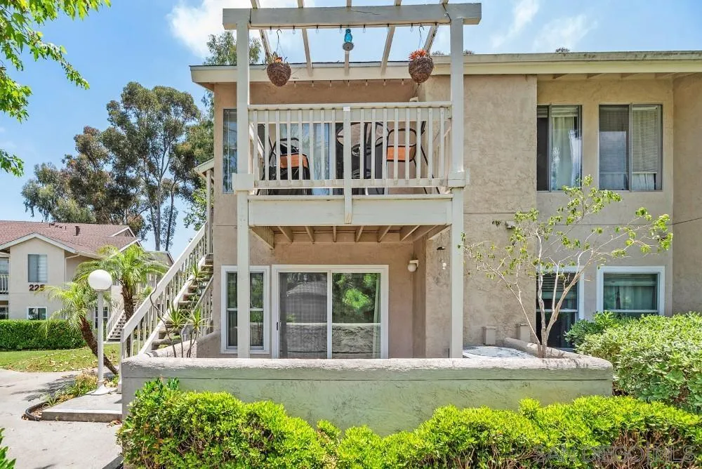 219 Diamond Way, Unit 115 Vista, CA 92083 - Photo 3 of 36 front view of a building with a garden