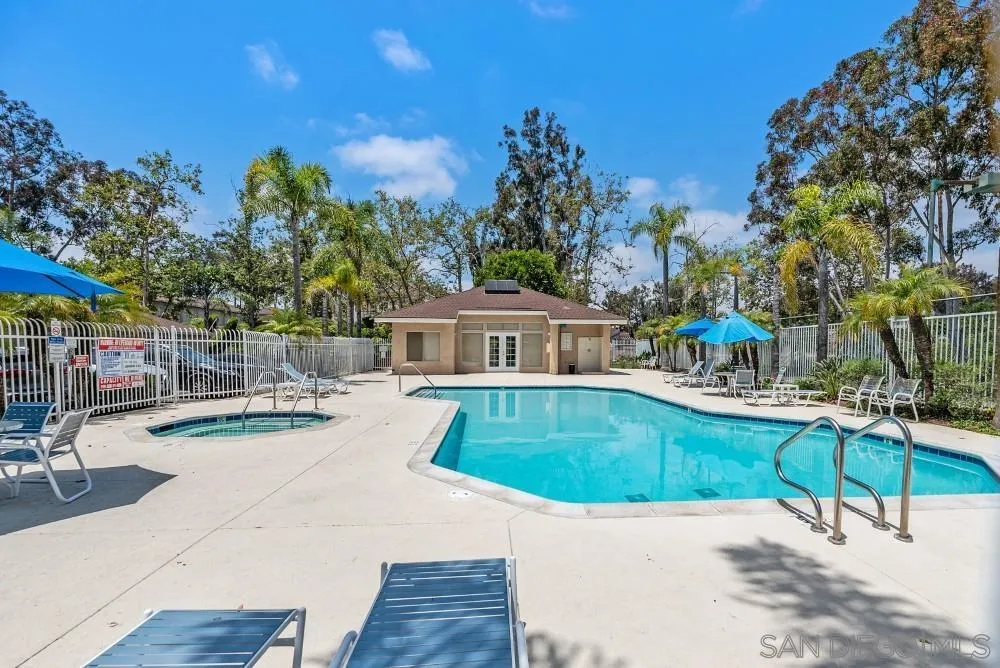219 Diamond Way, Unit 115 Vista, CA 92083 - Photo 32 of 36 a view of a swimming pool with an outdoor seating