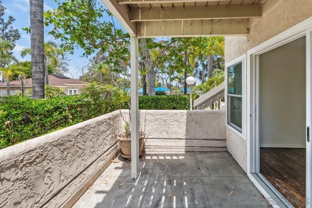 219 Diamond Way, Unit 115 Vista, CA 92083 - Photo 10 of 36 a view of balcony with wooden floor and fence