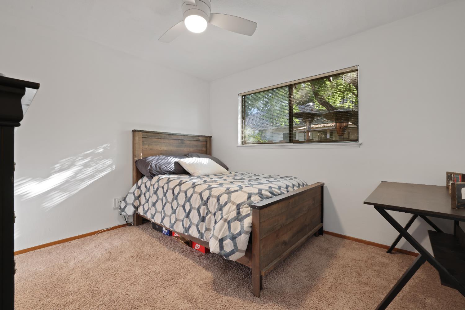 1608 Kruger Drive Modesto, CA 95355 - Photo 13 of 35 a bedroom with a bed and window