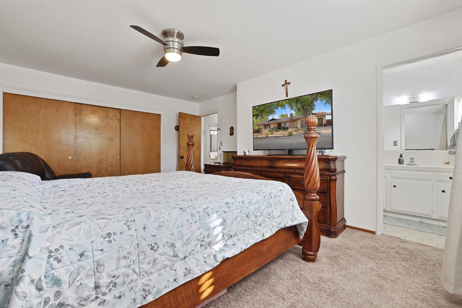 1608 Kruger Drive Modesto, CA 95355 - Photo 20 of 35 a bedroom with a bed and a flat screen tv