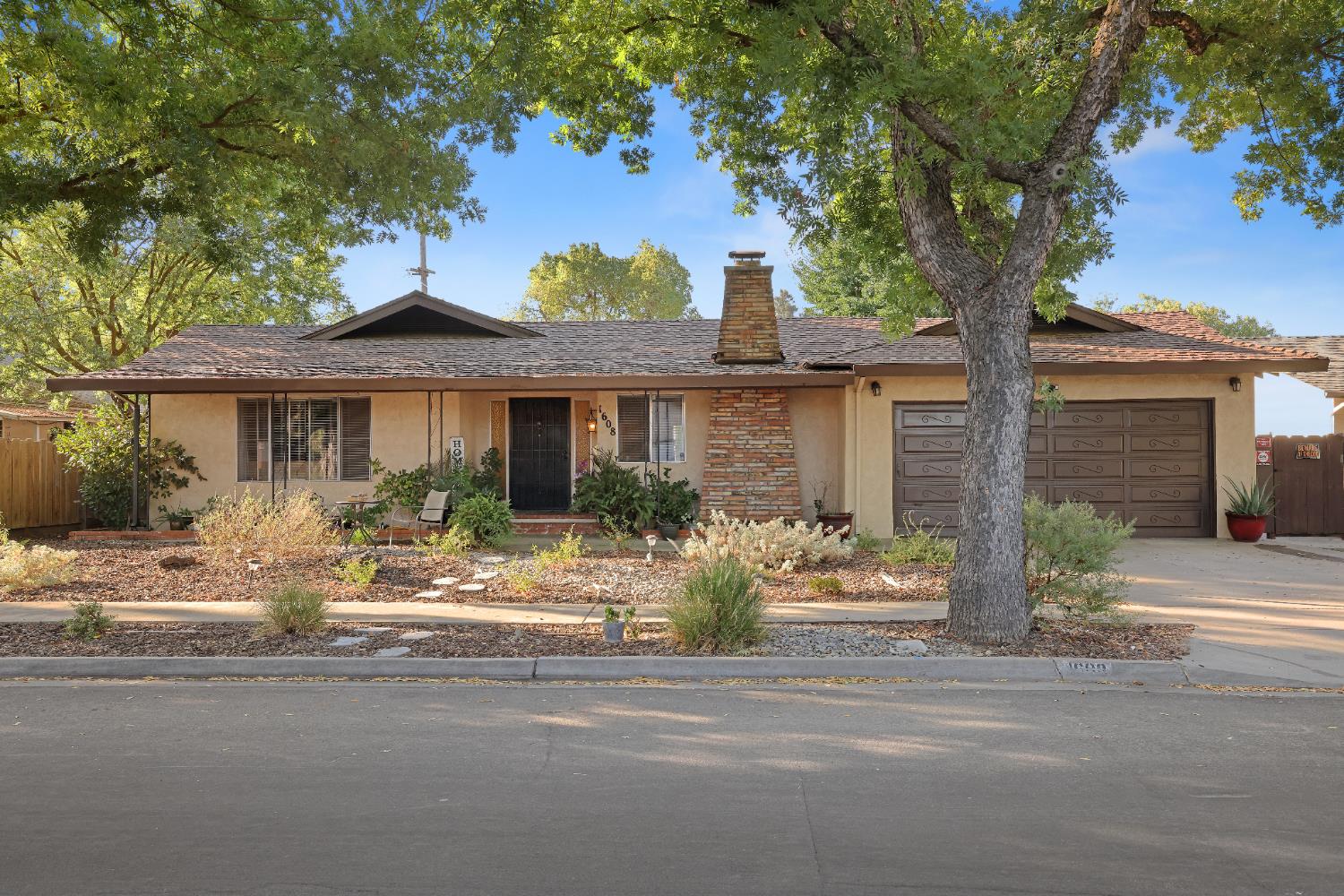 1608 Kruger Drive Modesto, CA 95355 - Photo 2 of 35 a front view of a house with porch