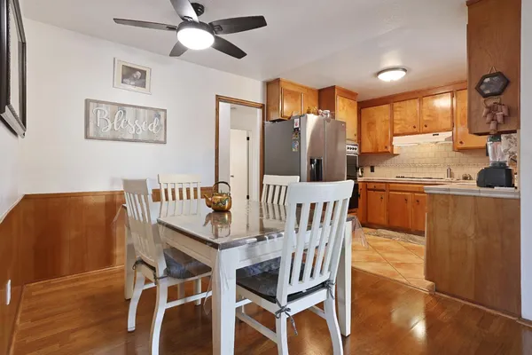 a view of a dining room with furniture and wooden floor