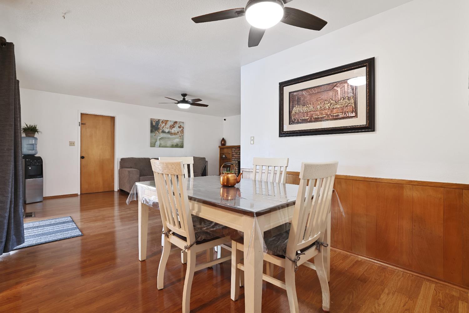 1608 Kruger Drive Modesto, CA 95355 - Photo 23 of 35 a view of a dining room with furniture and wooden floor