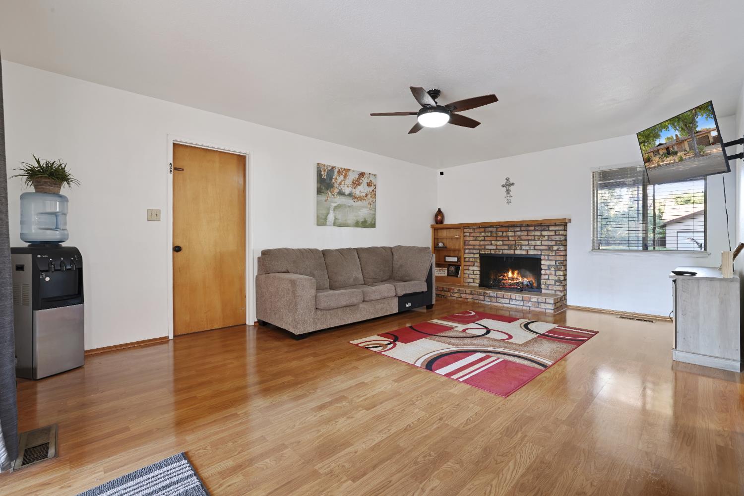 1608 Kruger Drive Modesto, CA 95355 - Photo 27 of 35 a living room with furniture and a fireplace