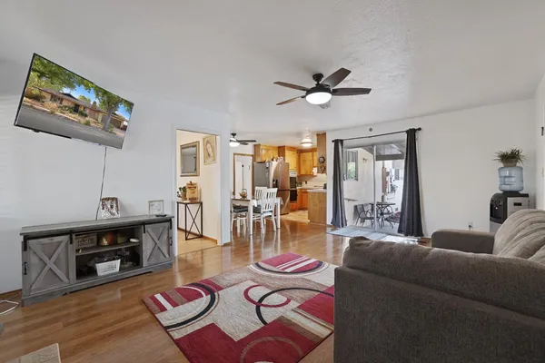 a view of a backyard with a table and chairs