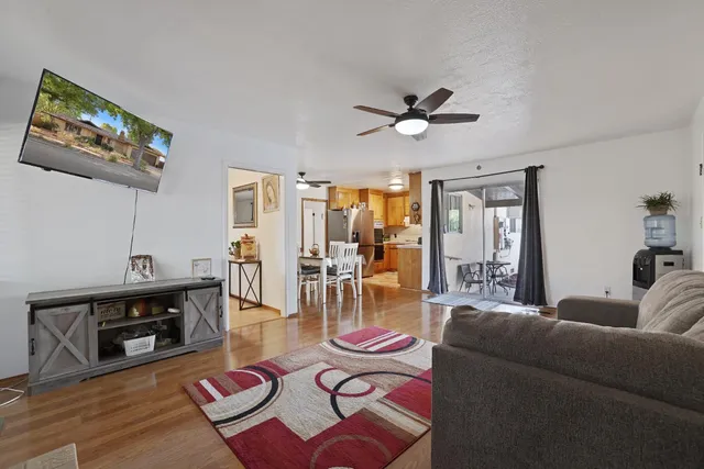 a view of a backyard with a table and chairs