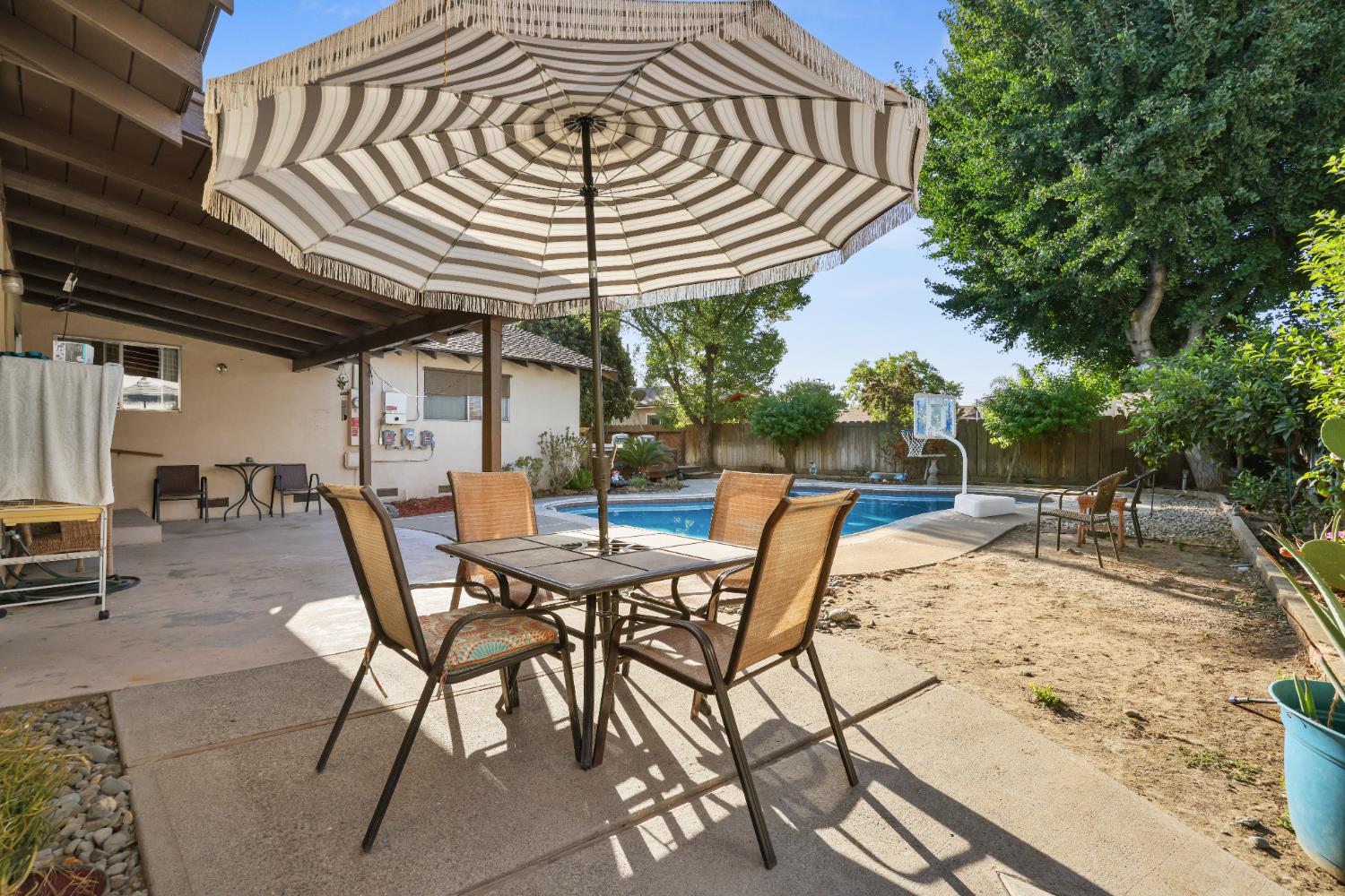 1608 Kruger Drive Modesto, CA 95355 - Photo 30 of 35 a view of a backyard with a table and chairs