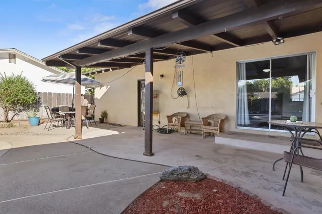 a view of a swimming pool with a patio