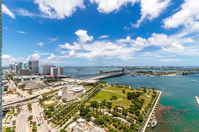 a view of a swimming pool with a table and chairs