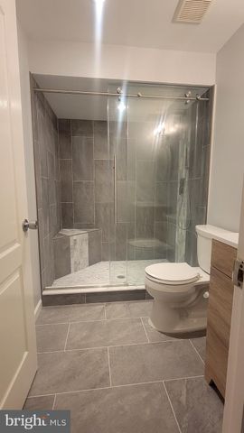 a view of a room with wooden floor and stairs