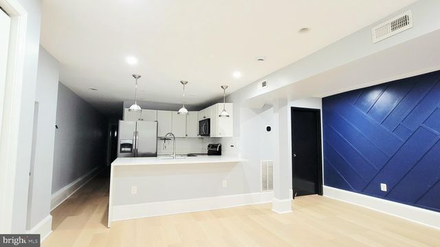 a living room with fireplace furniture and a flat screen tv