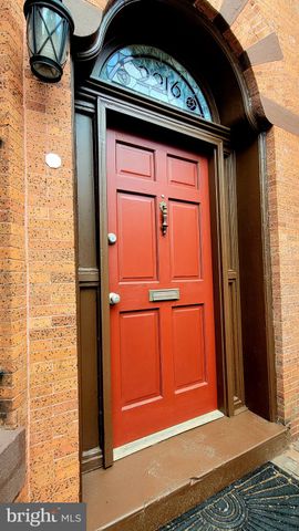 a bedroom with a bed and a tv