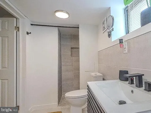 a view of a large building with wooden floor and fence