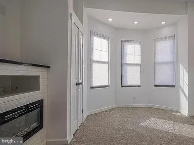 a bathroom with a sink toilet and mirror