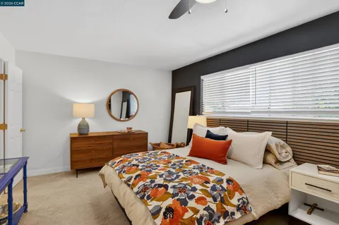 a bedroom with bed and window