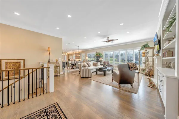 a dining room with furniture window and wooden floor