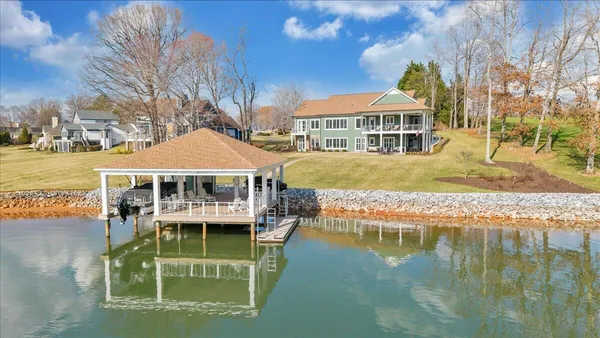 a living room with lots of furniture and a rug