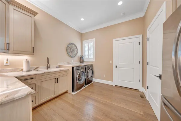 a very nice looking room with a large window and chandelier