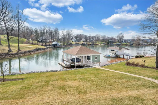 a living room with lots of furniture and a chandelier