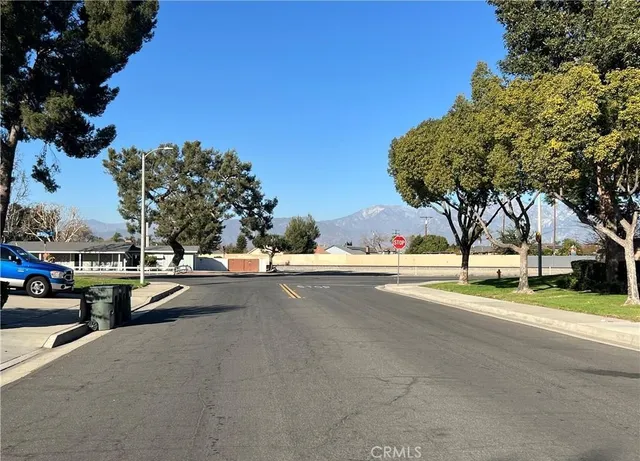 a view of a street with houses on both side