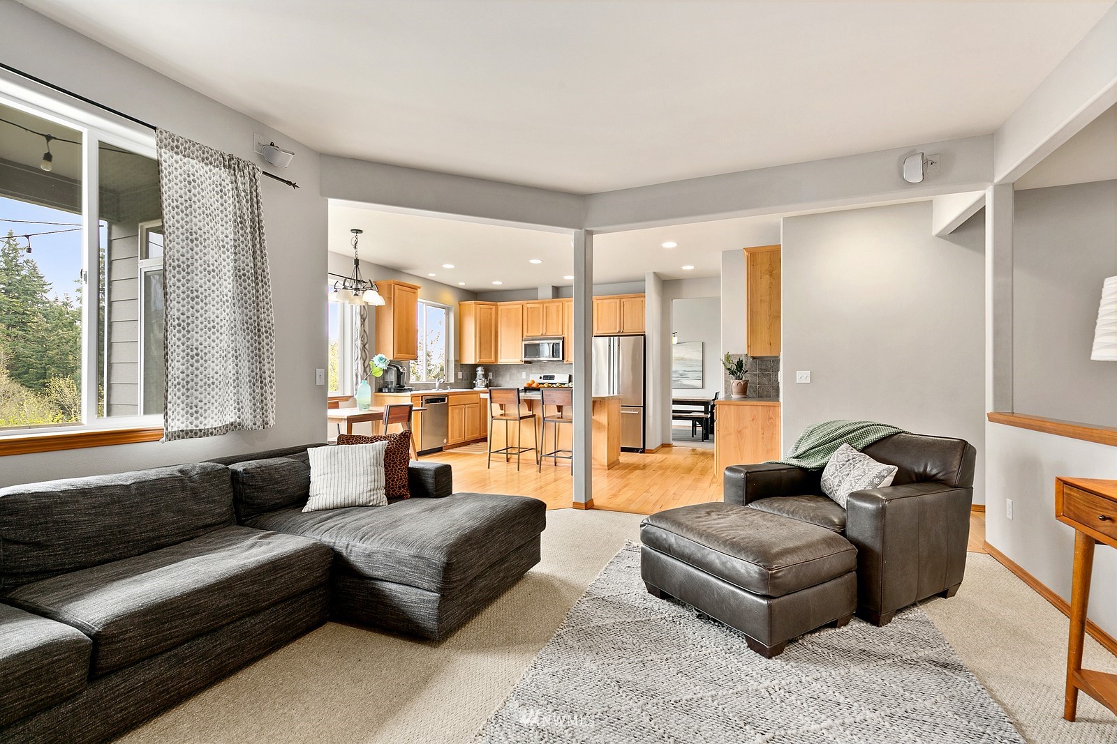 21117 Meridian Place West Bothell, WA 98021 - Photo 11 of 30 a living room with furniture and a large window
