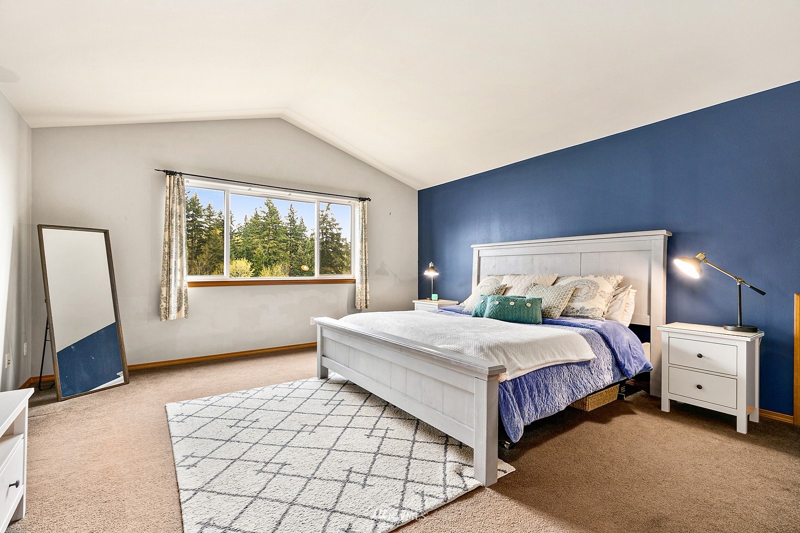 21117 Meridian Place West Bothell, WA 98021 - Photo 17 of 30 a bedroom with a large bed and a window