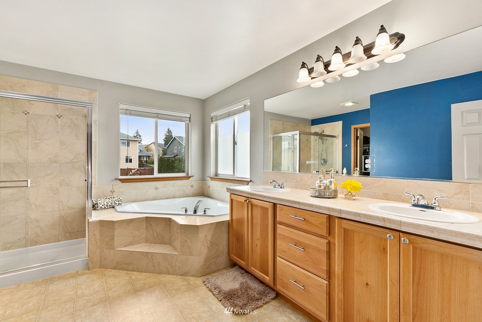 21117 Meridian Place West Bothell, WA 98021 - Photo 22 of 30 a spacious bathroom with a tub double sink and mirror
