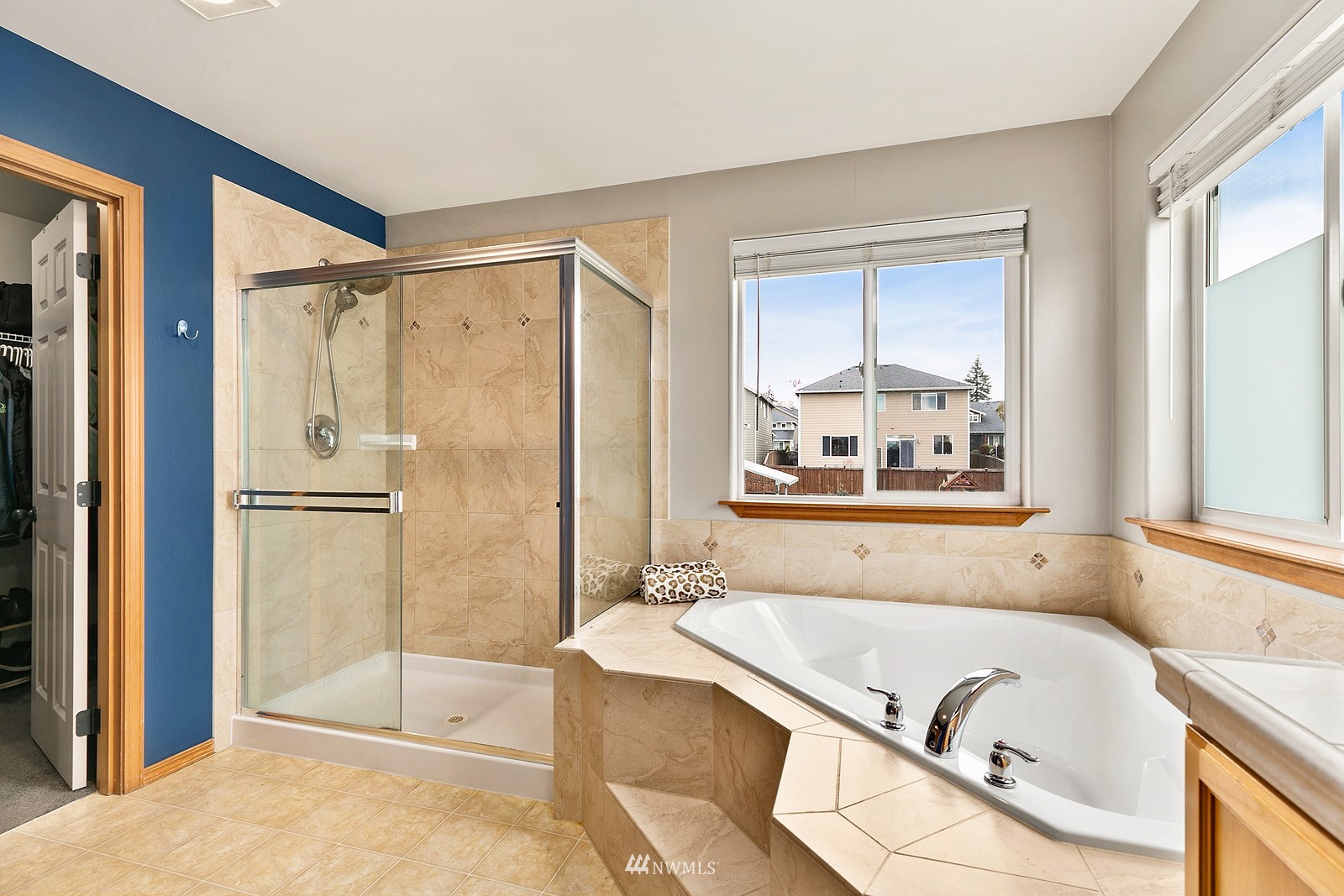21117 Meridian Place West Bothell, WA 98021 - Photo 23 of 30 a bathroom with a tub a sink and a window