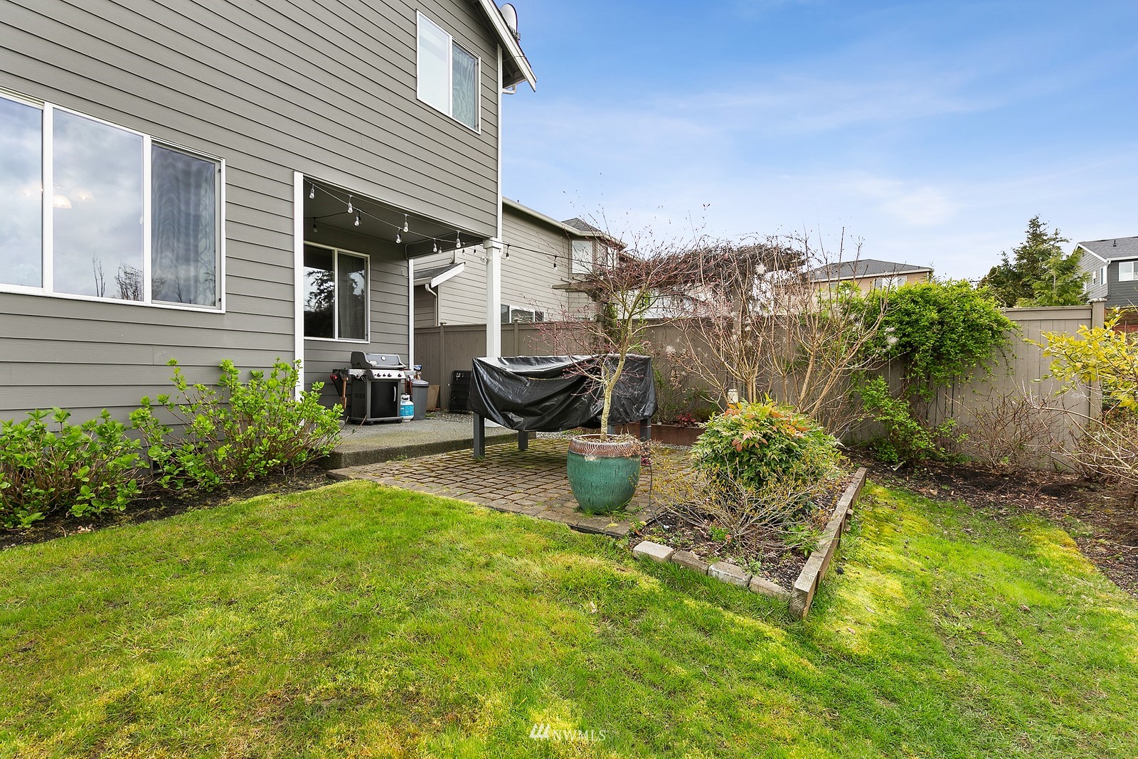 21117 Meridian Place West Bothell, WA 98021 - Photo 25 of 30 a backyard of a house with table and chairs