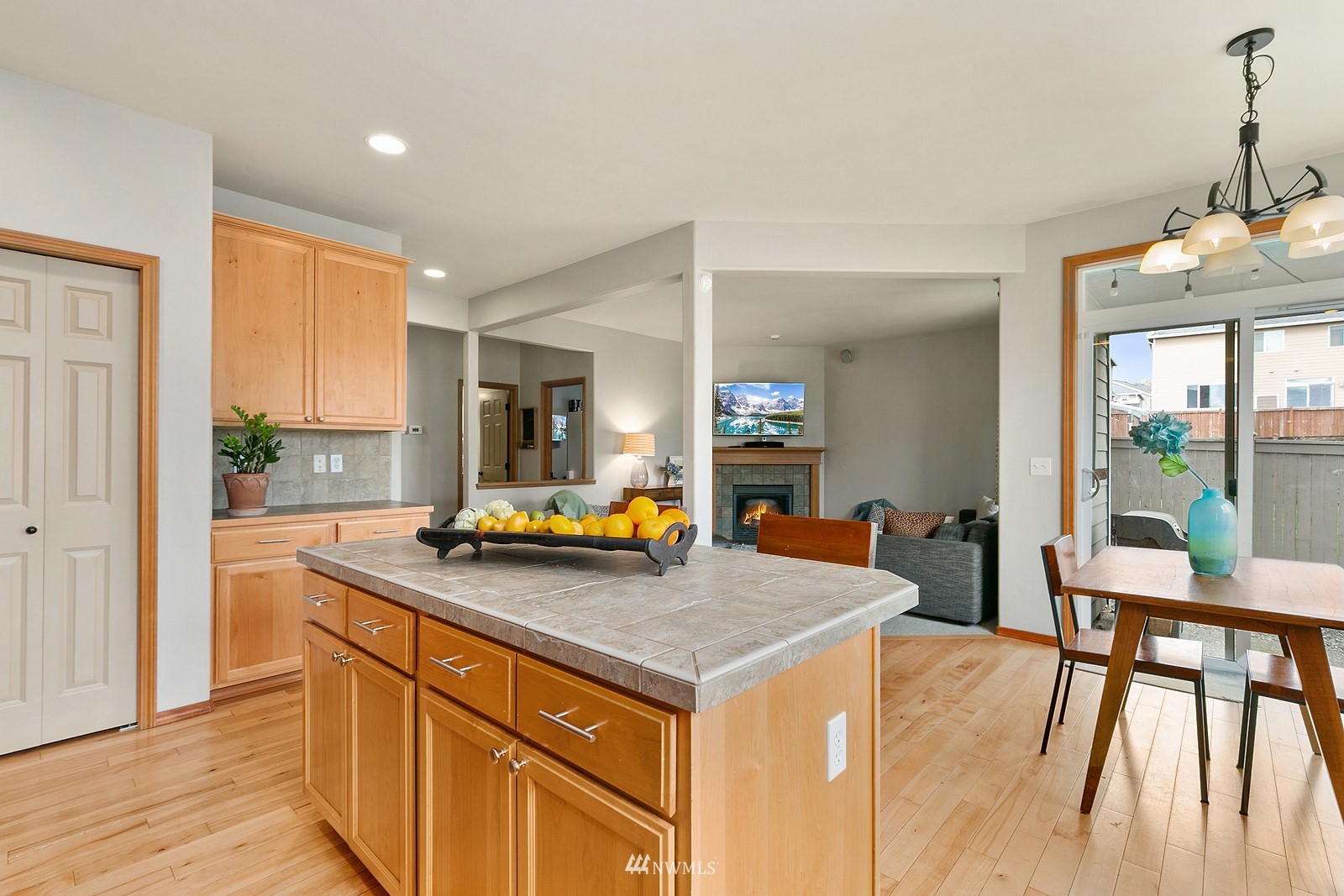 21117 Meridian Place West Bothell, WA 98021 - Photo 4 of 30 a view of a kitchen counter top space with furniture and wooden floor