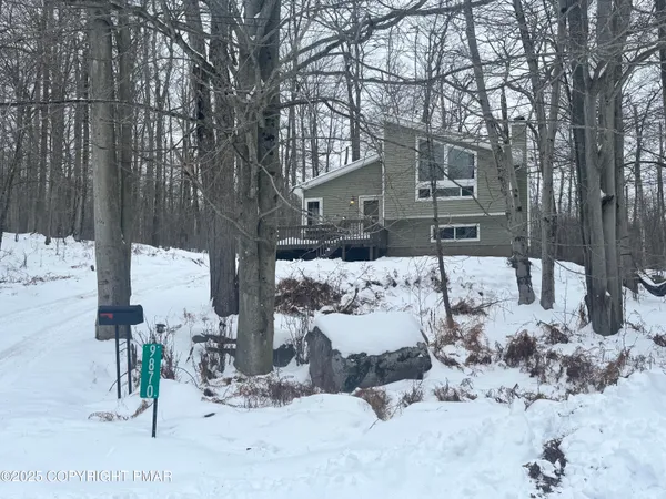 a view of snow on the roadside