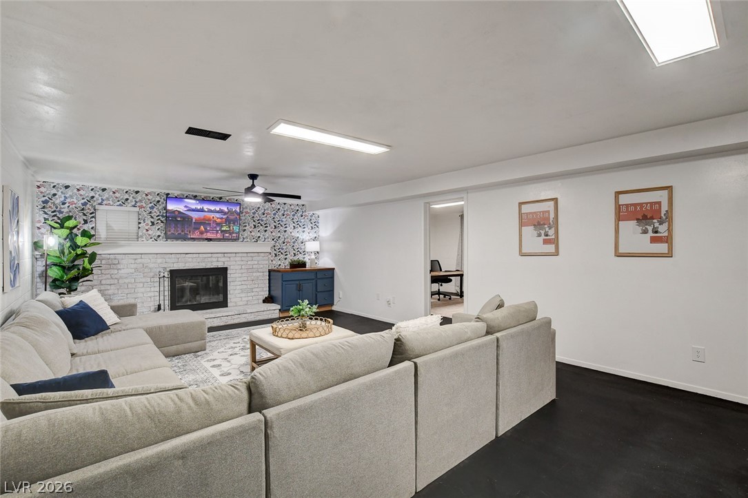 3765 Berkeley Street Logandale, NV 89021 - Photo 50 of 87 This inviting living room offers comfort and style, perfect for everyday relaxation and gatherings.