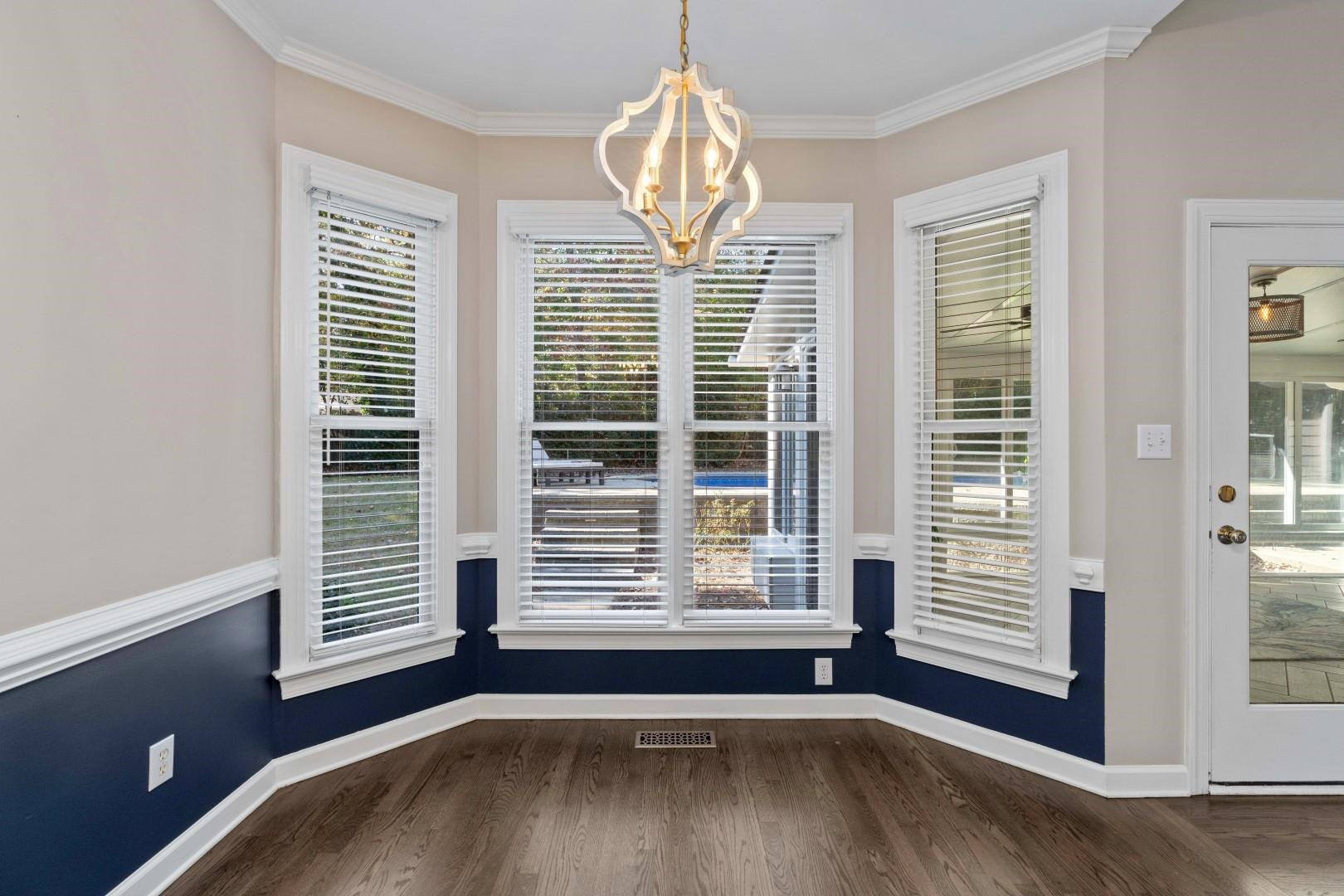 8215 Gadsen Court Raleigh, NC 27613 - Photo 11 of 48 a view of empty room with wooden floor and fan