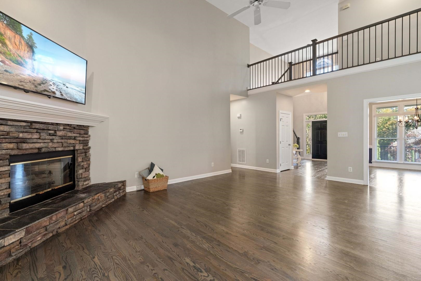 8215 Gadsen Court Raleigh, NC 27613 - Photo 15 of 48 a living room with wooden floor and a fireplace