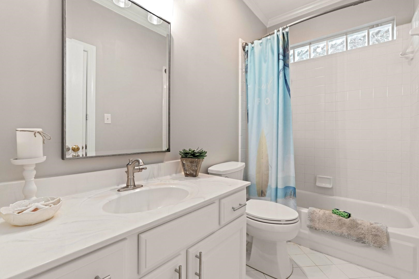 8215 Gadsen Court Raleigh, NC 27613 - Photo 30 of 48 a bathroom with a granite countertop sink a toilet and a mirror