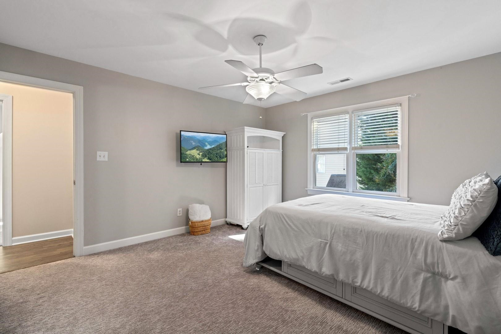 8215 Gadsen Court Raleigh, NC 27613 - Photo 36 of 48 a bedroom with a bed and a window