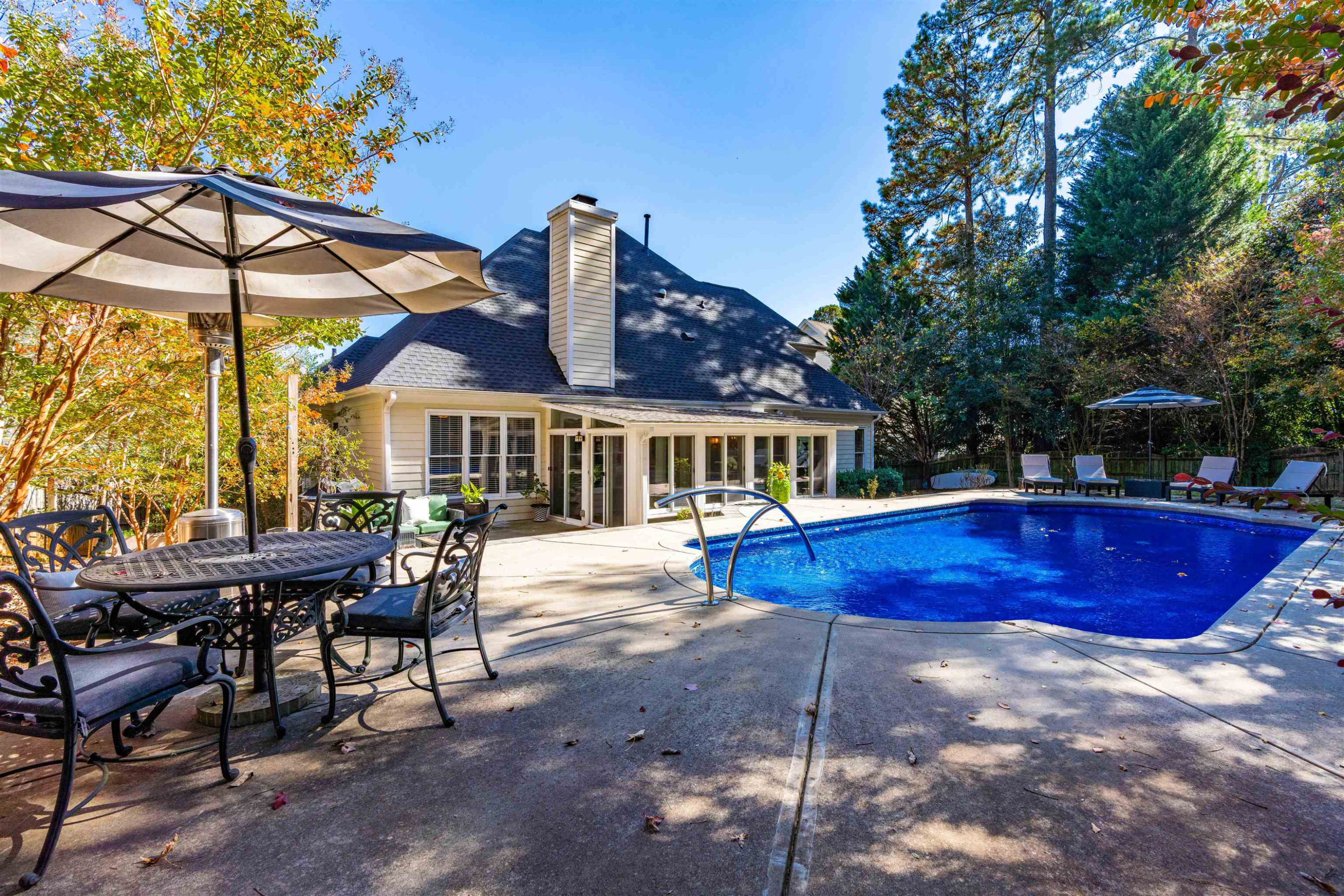 8215 Gadsen Court Raleigh, NC 27613 - Photo 42 of 48 a view of a house with swimming pool and sitting area
