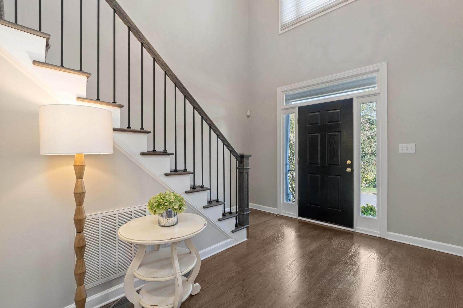 8215 Gadsen Court Raleigh, NC 27613 - Photo 5 of 48 a view of a hallway with furniture and wooden floor