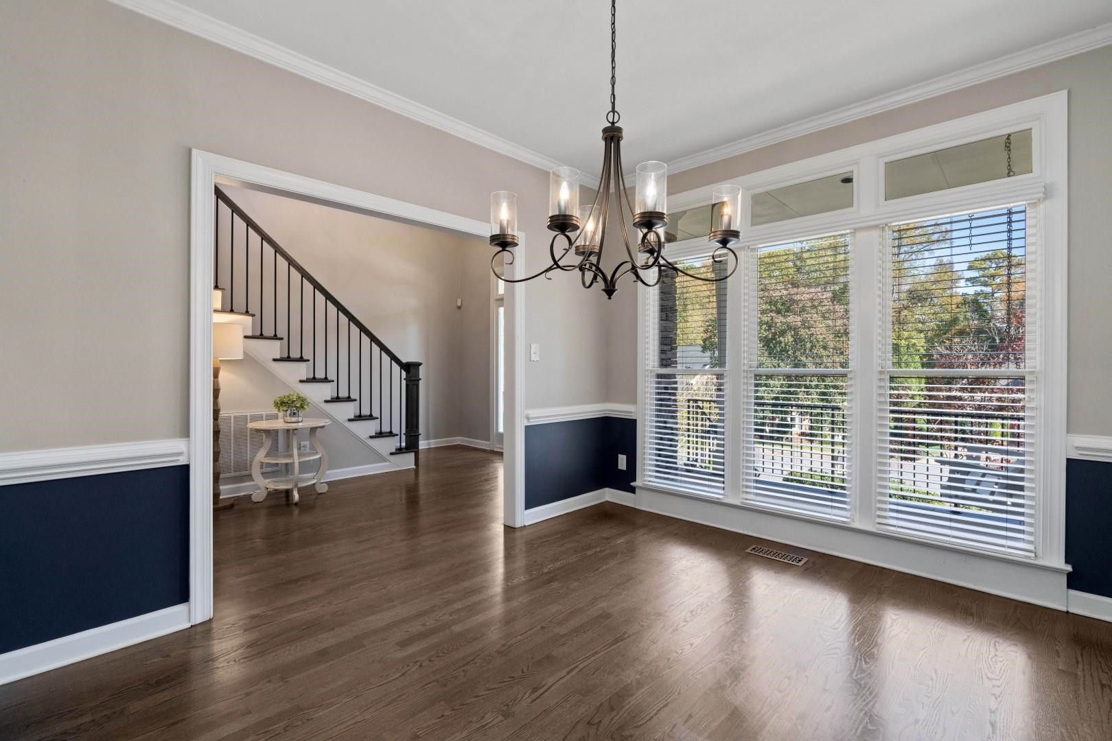 8215 Gadsen Court Raleigh, NC 27613 - Photo 6 of 48 a view of empty room with wooden floor and fan