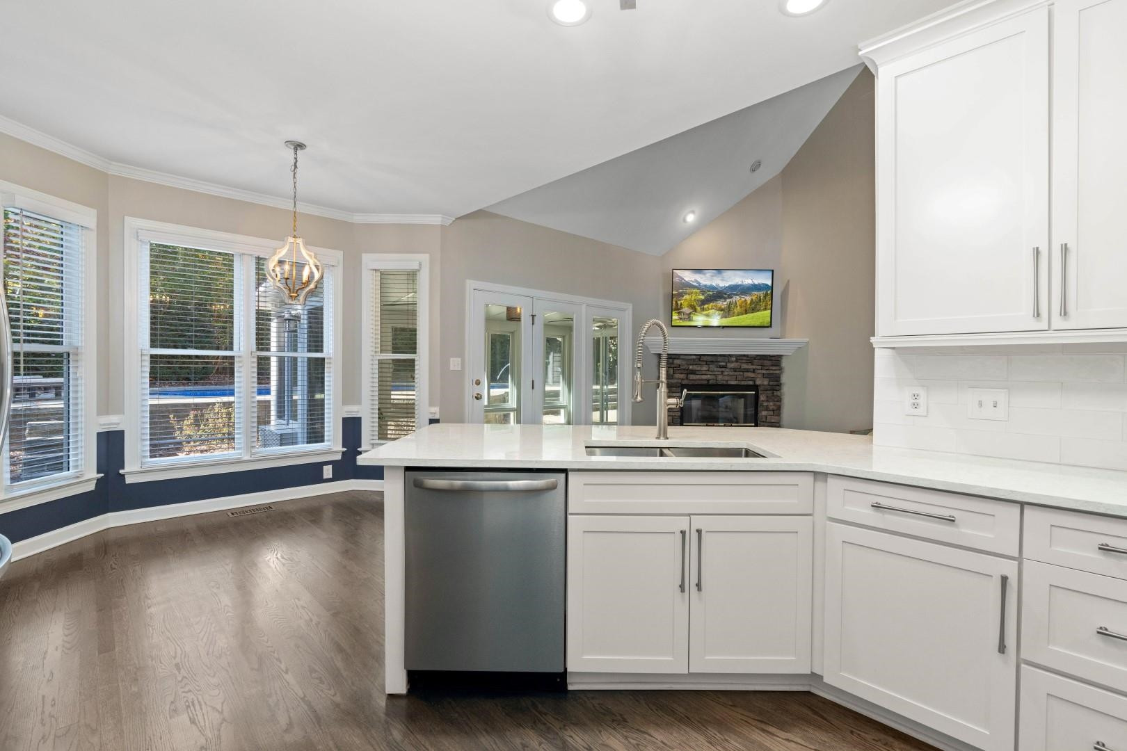 8215 Gadsen Court Raleigh, NC 27613 - Photo 10 of 48 a kitchen with cabinets and window